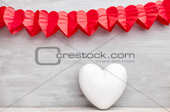 Love concept. Hearts hanging on grey background