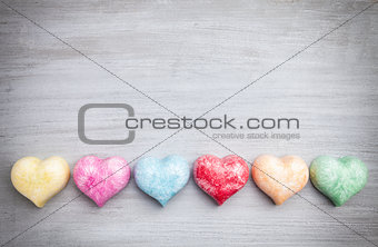 Love concept. Colorful hearts on grey background