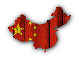 Map and flag of China on weathered wood