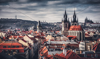 High spires towers of Tyn church in Prague city