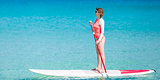 woman stand up paddling