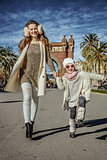 mother and daughter near Arc de Triomf in Barcelona walking