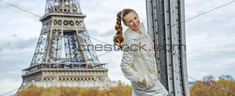 happy young fitness woman against Eiffel tower in Paris