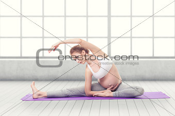 Portrait Of Pregnant Woman Doing Yoga