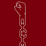 Fist on chain breaking link - liberation and freedom concept
