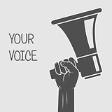 Hand holding megaphone - voice and opinion concept