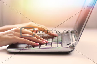 Closeup of woman with laptop