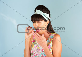 1950s woman coughing while smoking a joint