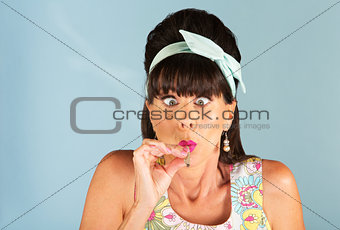 Cross eyed woman smoking a joint