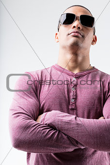 portrait on arms folded and sunglasses