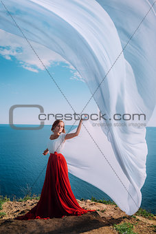 Beautiful Girl With White fabric on sea background