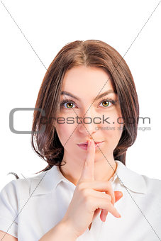Vertical portrait of a girl with finger on lips