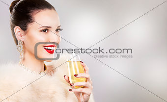 beautiful glamour woman holding champagne 