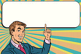 Businessman points up to copy space background