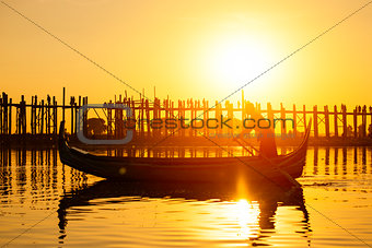 Fishman under U bein bridge at sunset