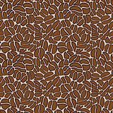 Seamless pattern made up of coffee beans in brown.