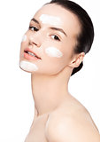 Beauty woman girl with face cream natural makeup