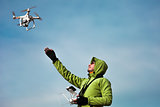 Man operating a drone