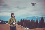 Man operating a drone