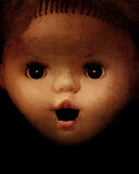 Grunge background with vintage evil spooky doll face