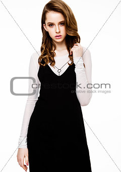 Young beautiful fashion model wearing black dress