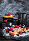 Cottage cheese pancakes decorated with fresh berries