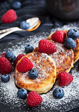 Cottage cheese pancakes decorated with fresh berries