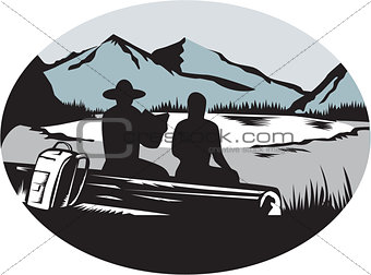 Two Trampers Sitting on Log Lake Mountain Oval Woodcut