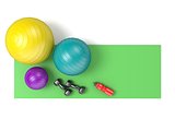 Fitness ball, dumbbells and plastic water bottle on green yoga m