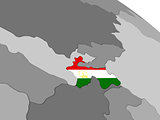 Tajikistan on globe with flag