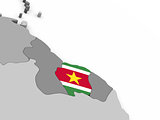 Suriname on globe with flag