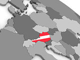Austria on globe with flag