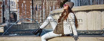 Full length portrait of tourist woman in Milan, Italy relaxing