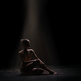 woman ballet dancer on dark background
