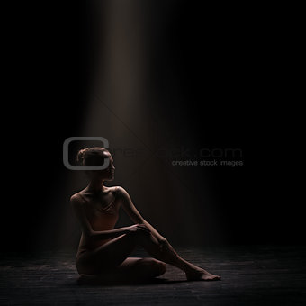 woman ballet dancer on dark background
