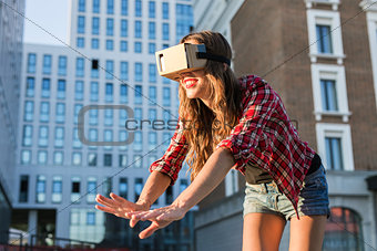 Woman with virtual reality goggles in the city