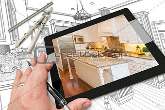 Hand on Computer Tablet Showing Photo of Kitchen Drawing Behind 