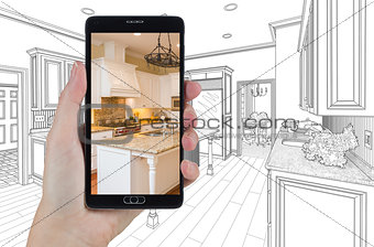 Hand Holding Smart Phone Displaying Photo of Kitchen Drawing Beh