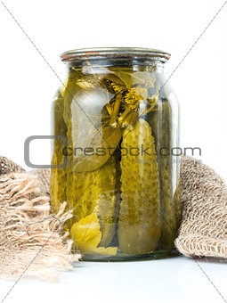 Pickles in glass jar isolated on white