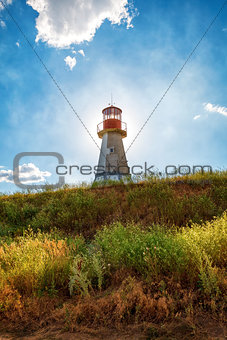 Lighthouse on background blue sky with cloud