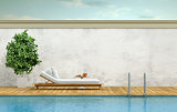 Swimming pool with chaise lounge