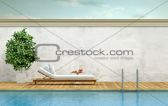Swimming pool with chaise lounge