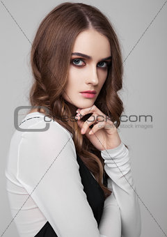 Young beautiful fashion model wearing black dress