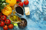 Italian food ingredients - vegetables, olive oil, spices and pasta