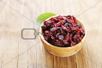 Dried berries red cranberries on a wooden table