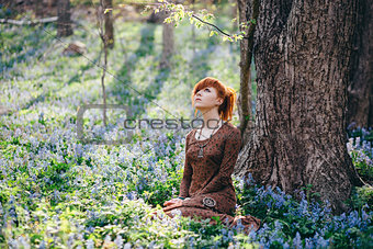 Beautiful young woman in the forest