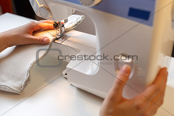 Photo of girl with sewing-machine