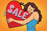 Beautiful young woman hugging sale Valentine heart