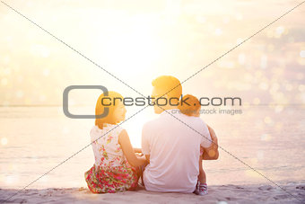 Family enjoying sunset view at beach
