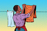 Vintage employee hangs up to dry clothes